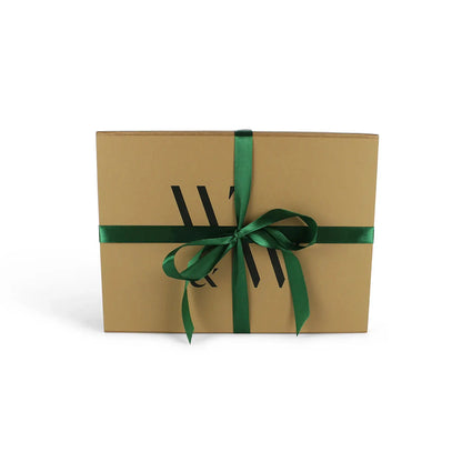 Packaging for a Limited Edition Grow Your Own Herbs Kit by Wilding and Wonder, including a brown cardboard gift box with the W&amp;W logo and green ribbon.