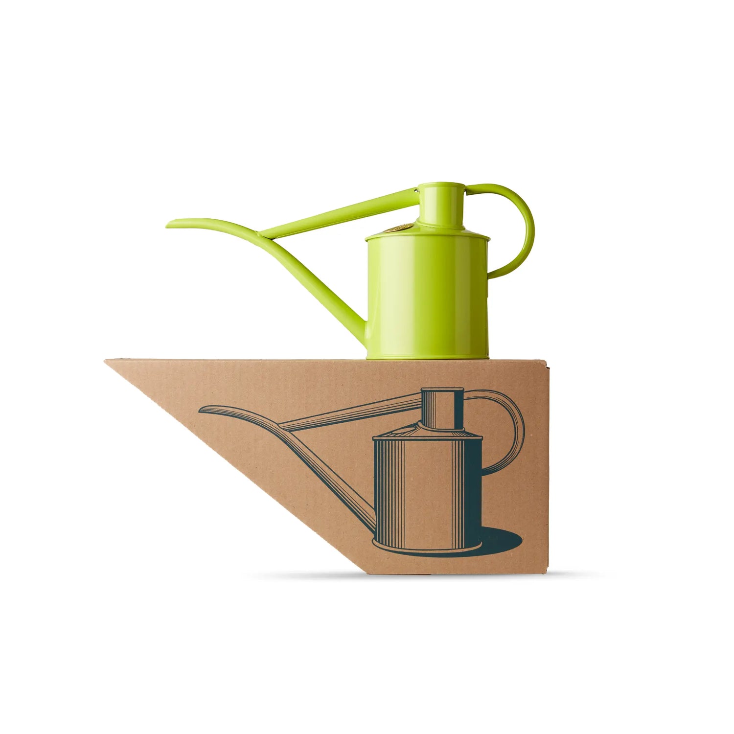 A Haws Fazeley Flow metal watering can in apple green, on top of shaped packaging with an illustration of the watering can on it. 