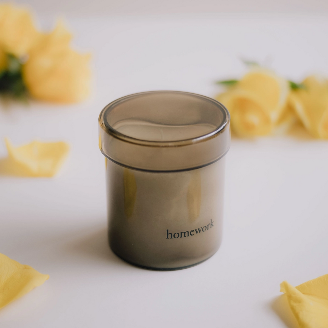 Glass jar candle with lid labeled &