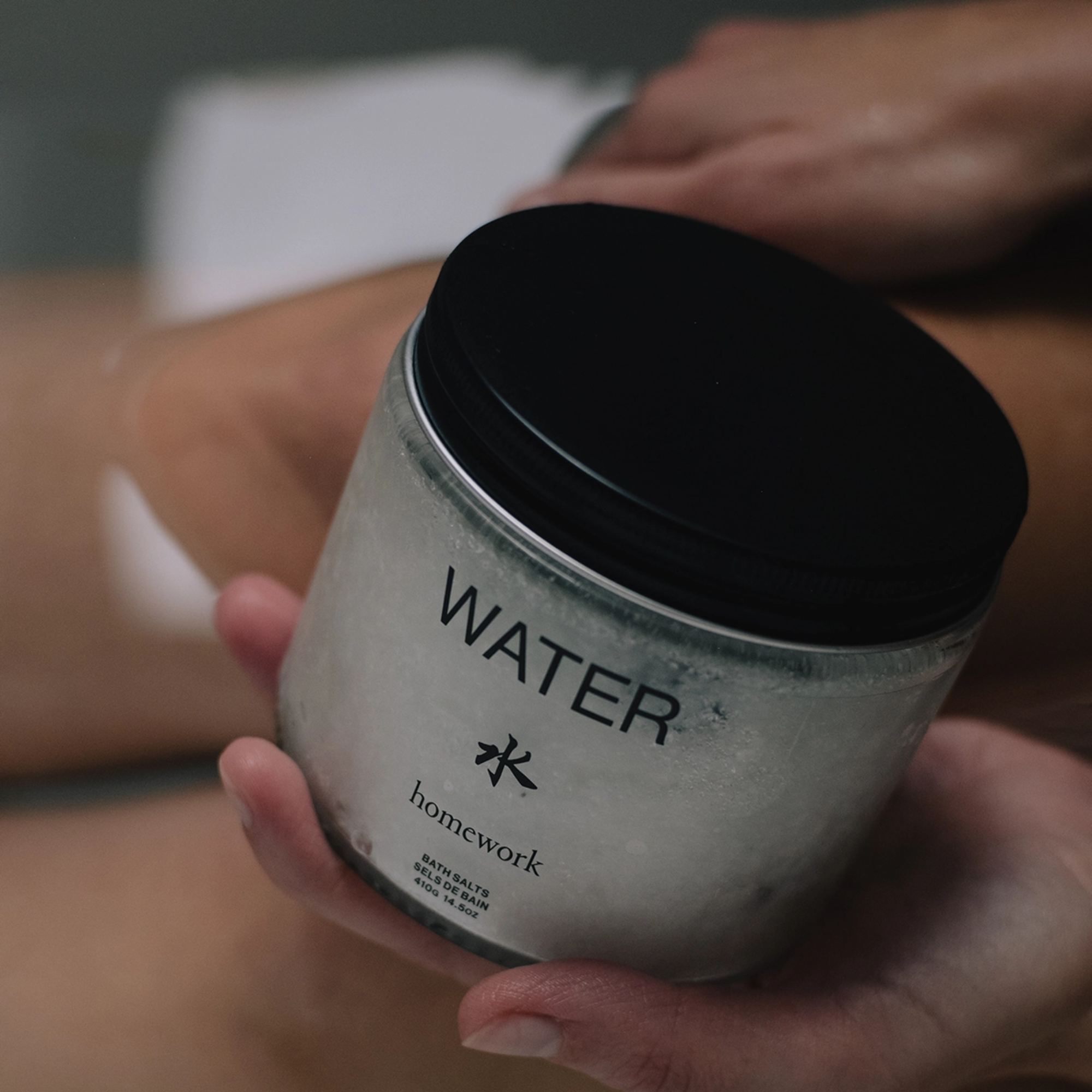 Person Holding Bath Salts by Homework - Water Variant - For Muscle Relaxation - Wilding & Wonder