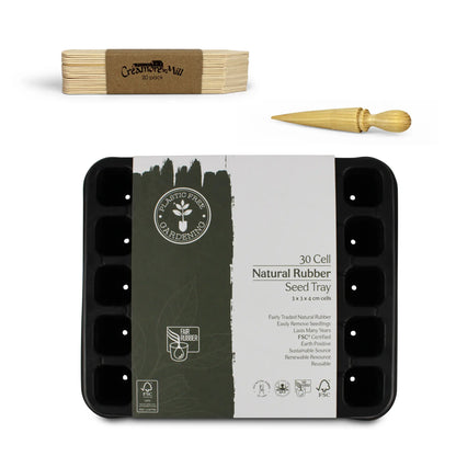 Natural rubber seed tray with wooden seed labels and wooden seed dibber on a white background.